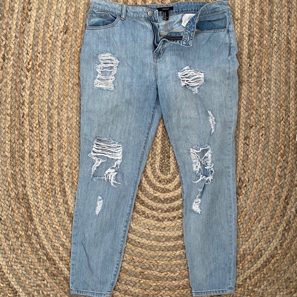 Distressed light denim jeans